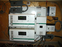 which in turn deliver the power as AC current to the facilities through the inverters (the white boxes)